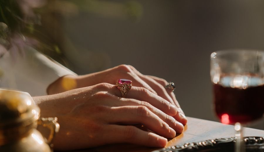 Elegant hands wearing fine jewelry