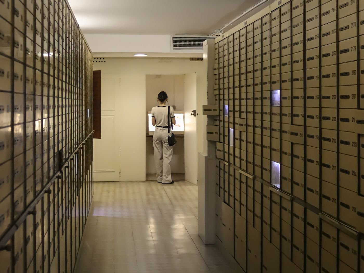 Client accessing a private safety deposit box inside a ValoriaVault facility